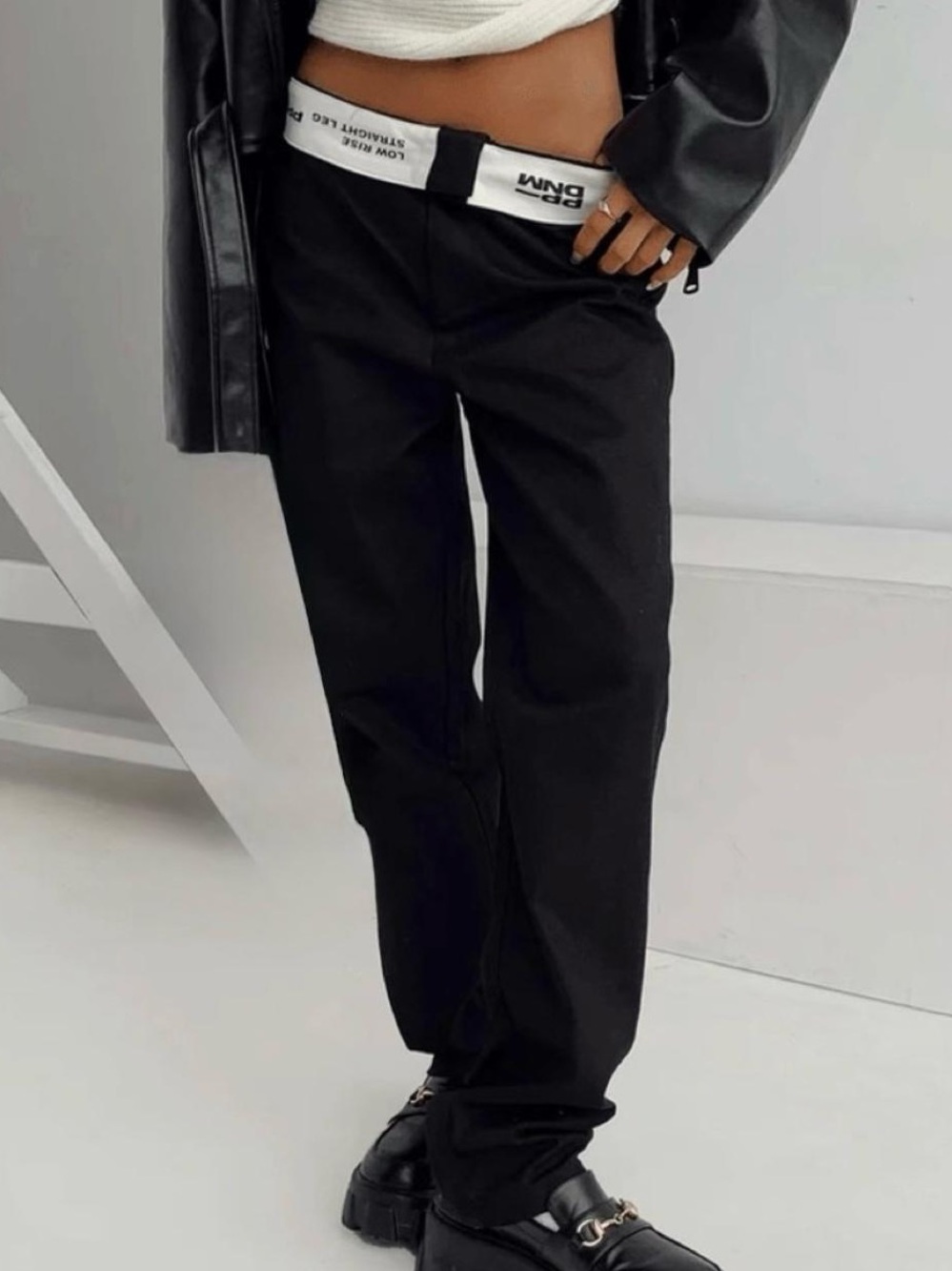 Black low rise straight leg trousers with fold over waist